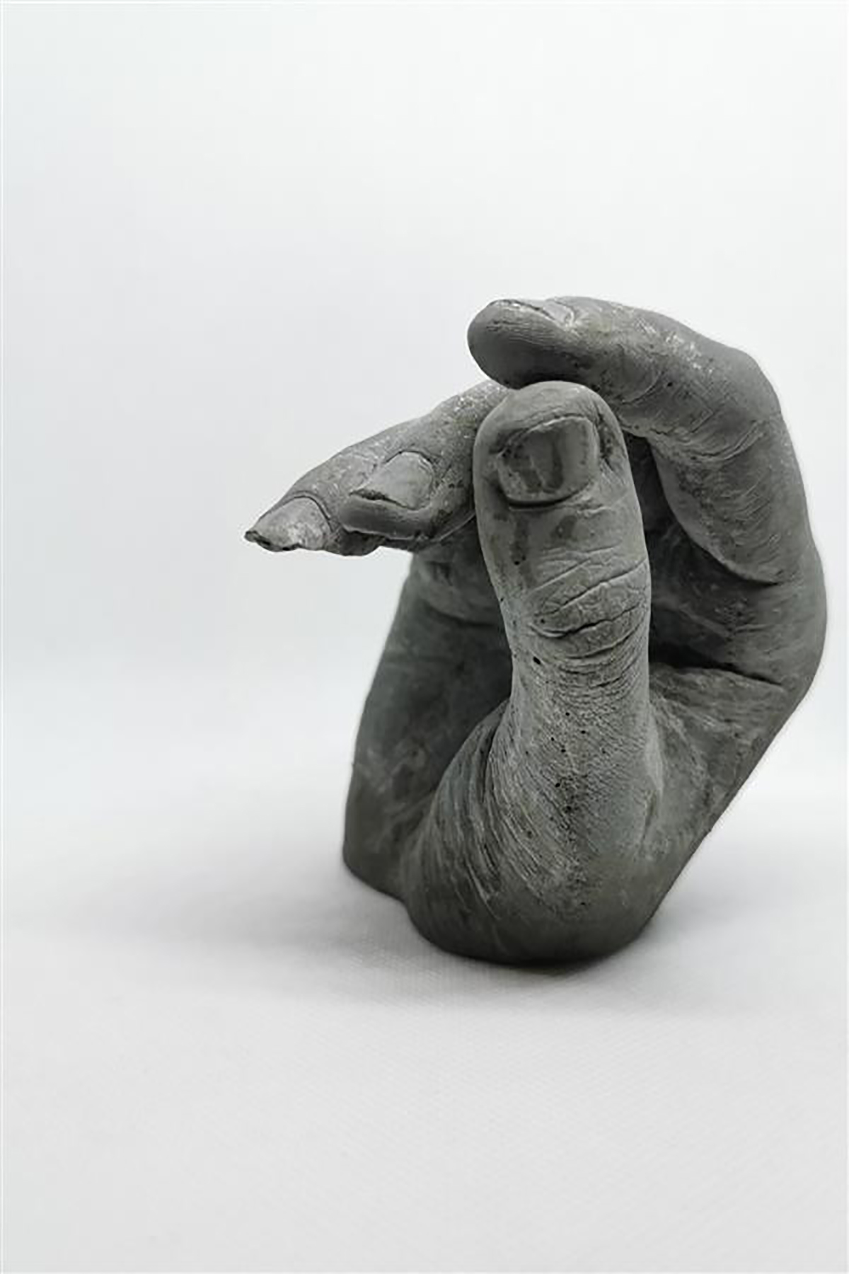 close enough not to touch by Kate McSharry, 10x15x10cm, cast concrete.