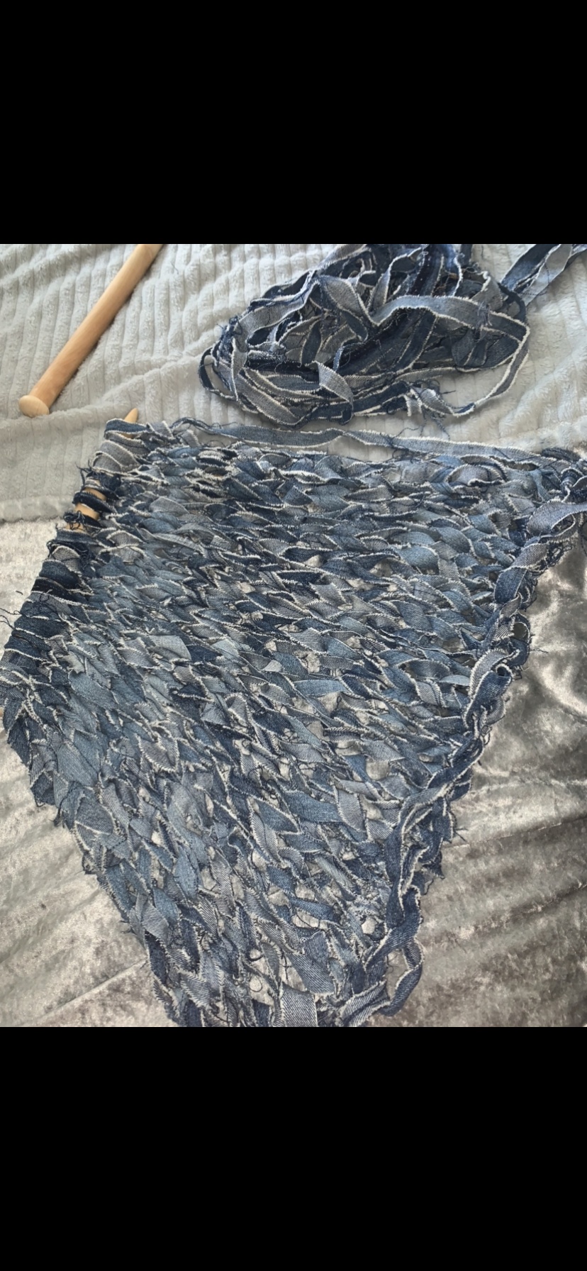 By Clara Weinmann. This is an image of my first garment. I am using old denim jeans that I collected, I wanted to upcycle in my final collection as it is something I have great interest in. I decided to cut them up into strips, sew them together and knit them. I used this technique as I felt it expresses the destressed and worried emotions I felt during covid.