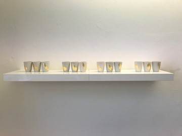 Meditation by Caitríona Lynch. Slip cast porcelain, gold leaf brushstroke.